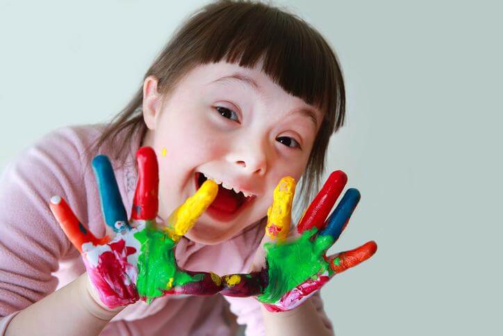 Child showing painted hands