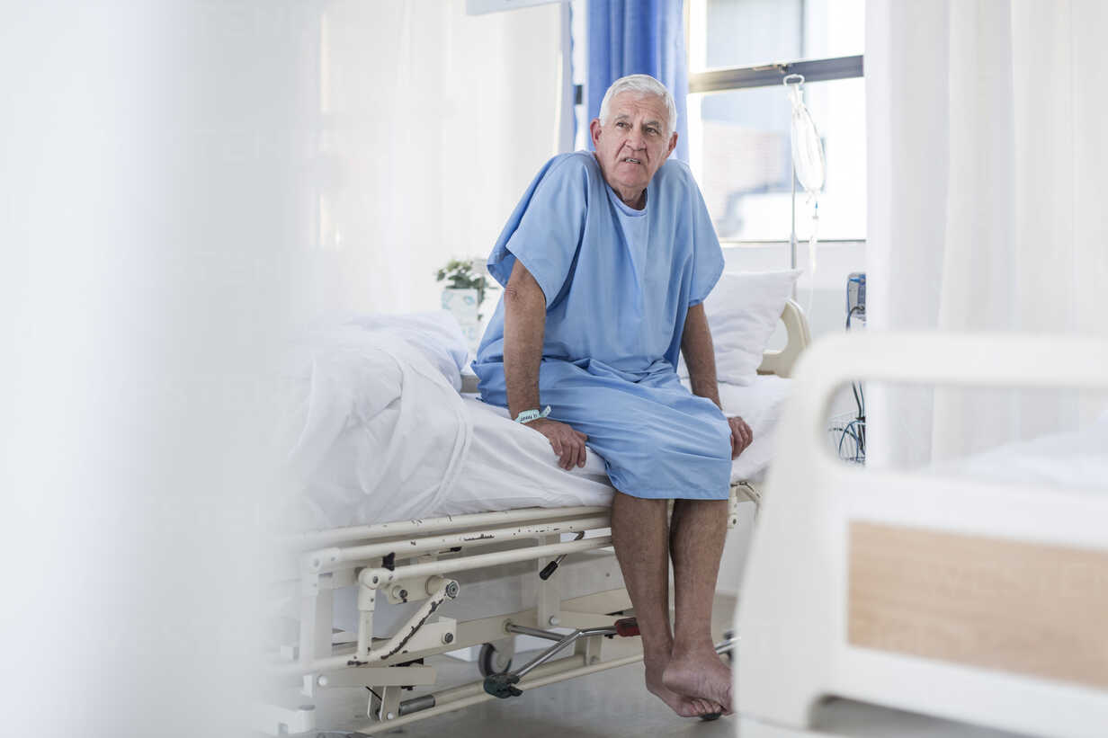 Senior patient sitting on hospital bed