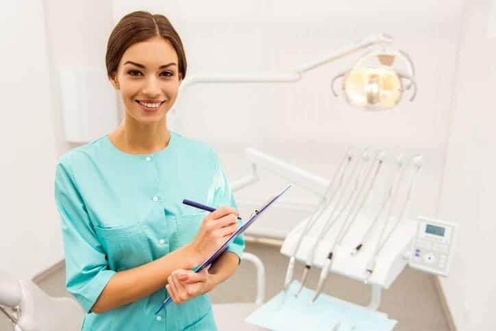 female dental assistant smiling