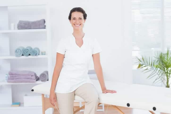 massage therapist smiling in photo