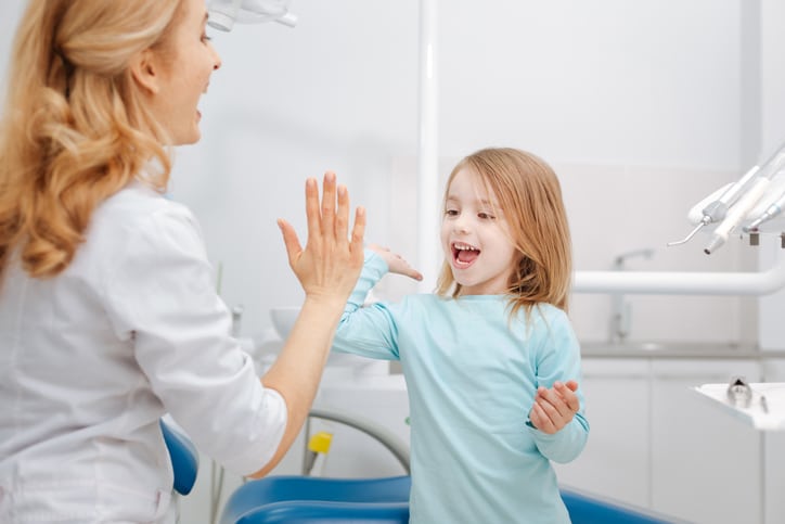 Staying positive can help children feel more comfortable at the dentist’s office