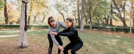 A couple of women training outdoors in the park