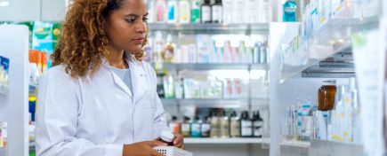 Mid adult female pharmacist working in a pharmacy