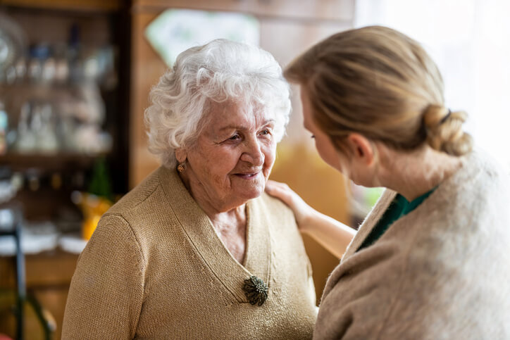 A PSW grad practicing GPA dementia care with an elderly client