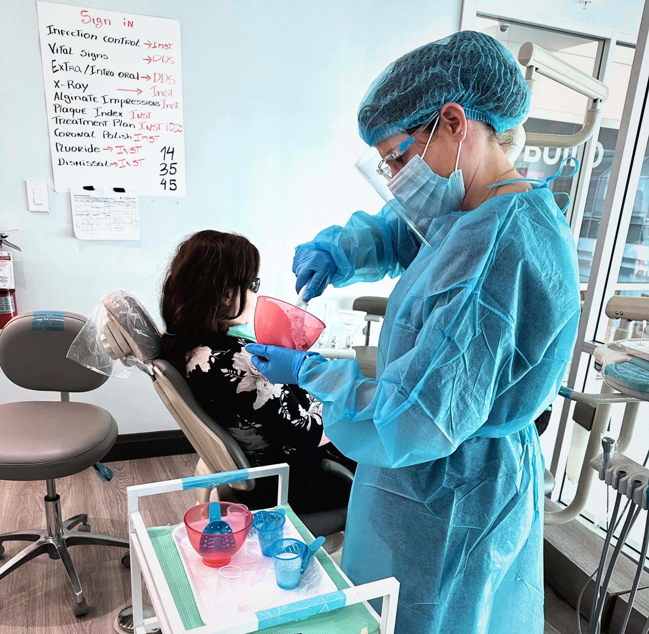 A dental assisting program student preparing a treatment solution during her practicum at Medix College