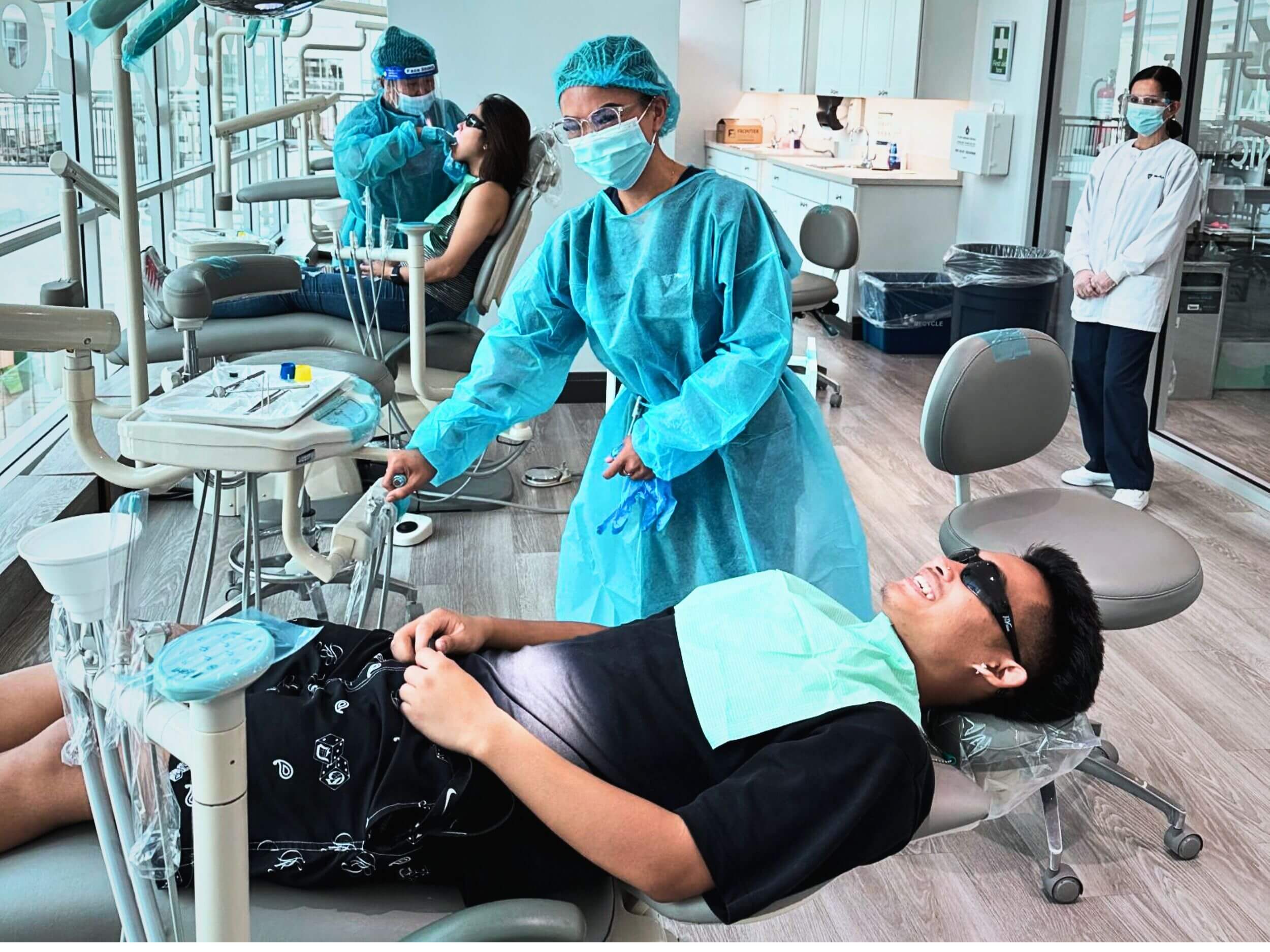 A dental assisting program student assisting a patient during her practicum at Medix College