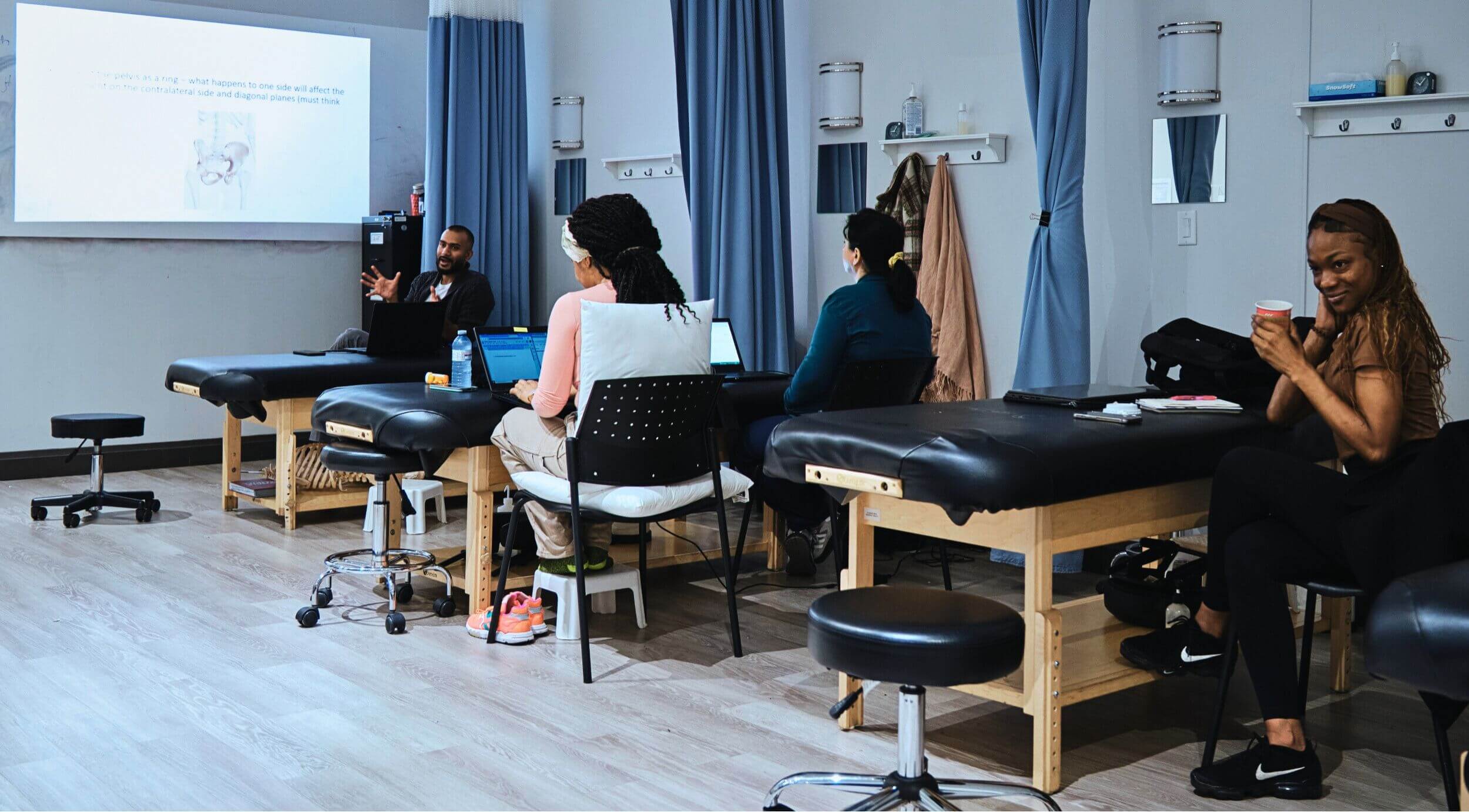 A group of students during a presentation while taking healthcare courses in Canada