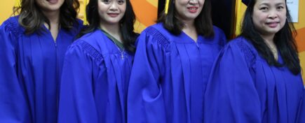 A group of personal support worker graduates posing for a photo