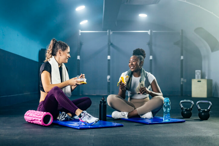 A professional nutrition coach working with a client, showcasing personal one-on-one consultation, highlighting health and fitness career opportunities.