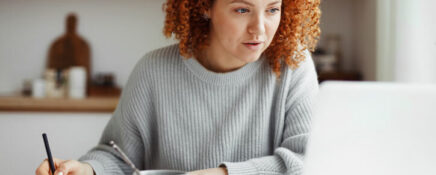 A flexible learning student doing coursework from home on a laptop