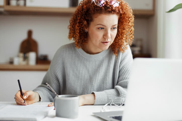 A flexible learning student doing coursework from home on a laptop