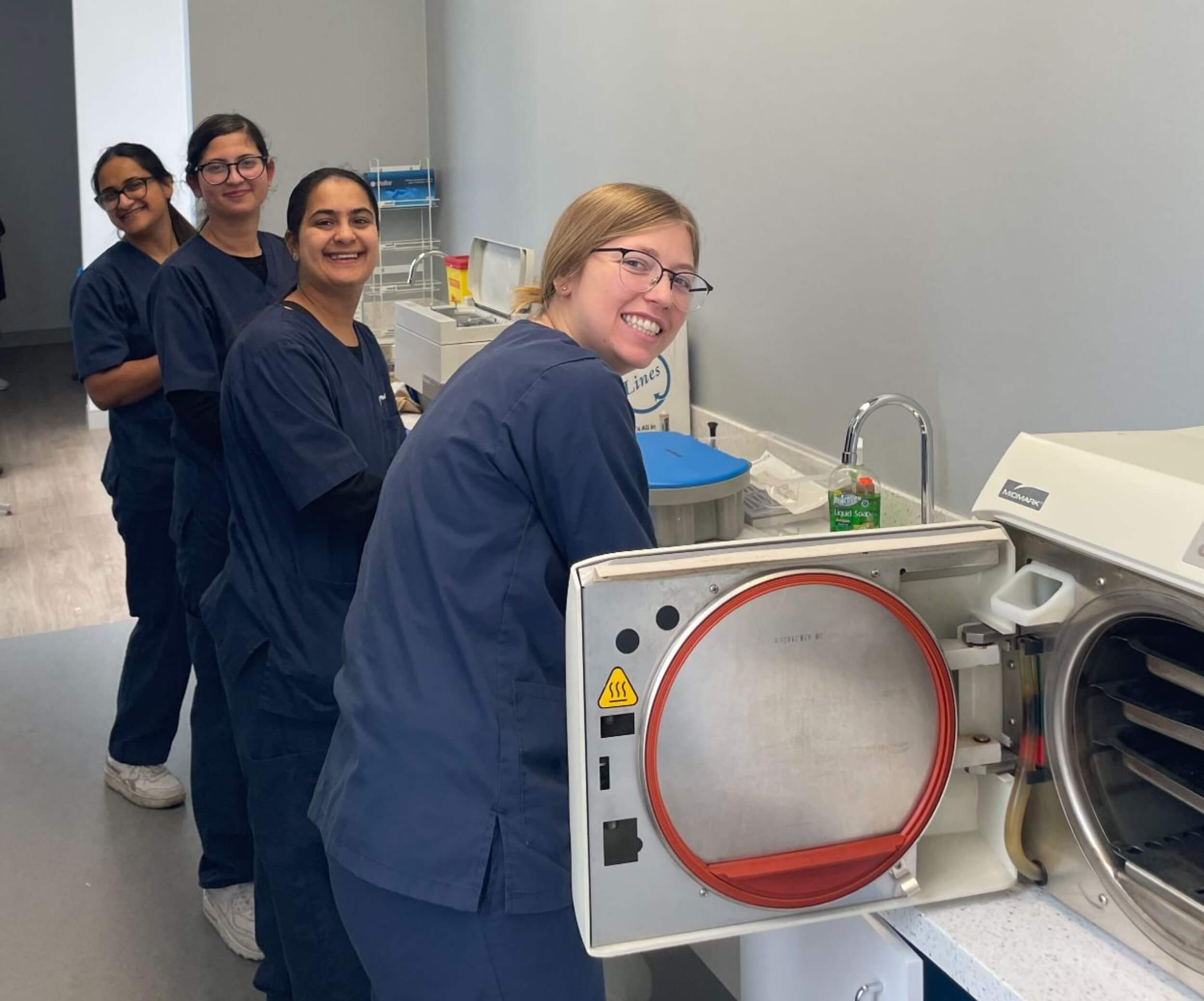 A group of flexible learning Medix students working together in a lab