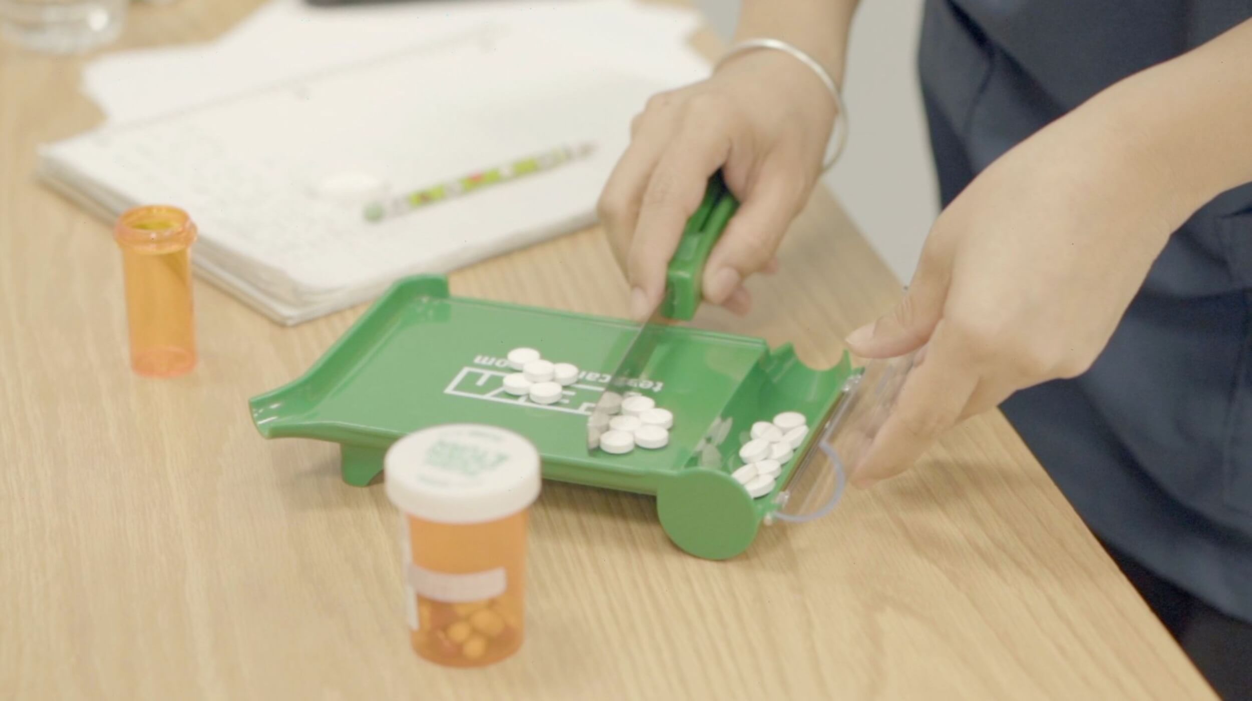 A student in the pharmacy assistant program measuring medication