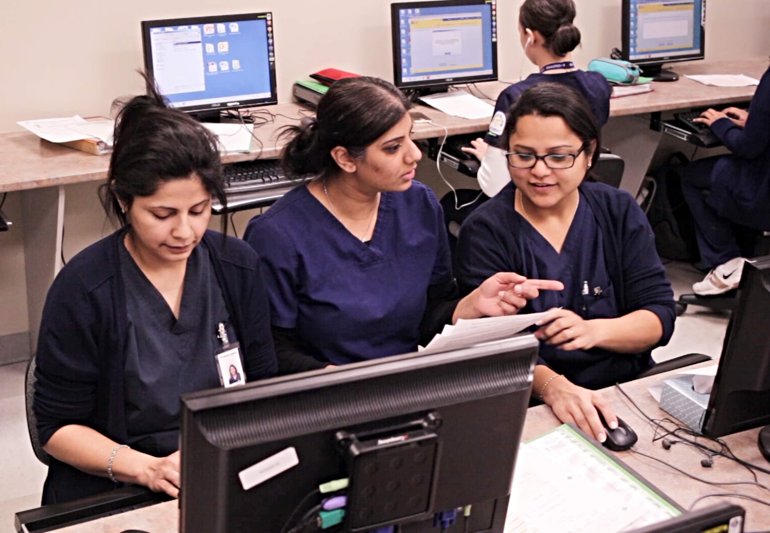 A group of future medical office administration course graduates gaining hands-on training.