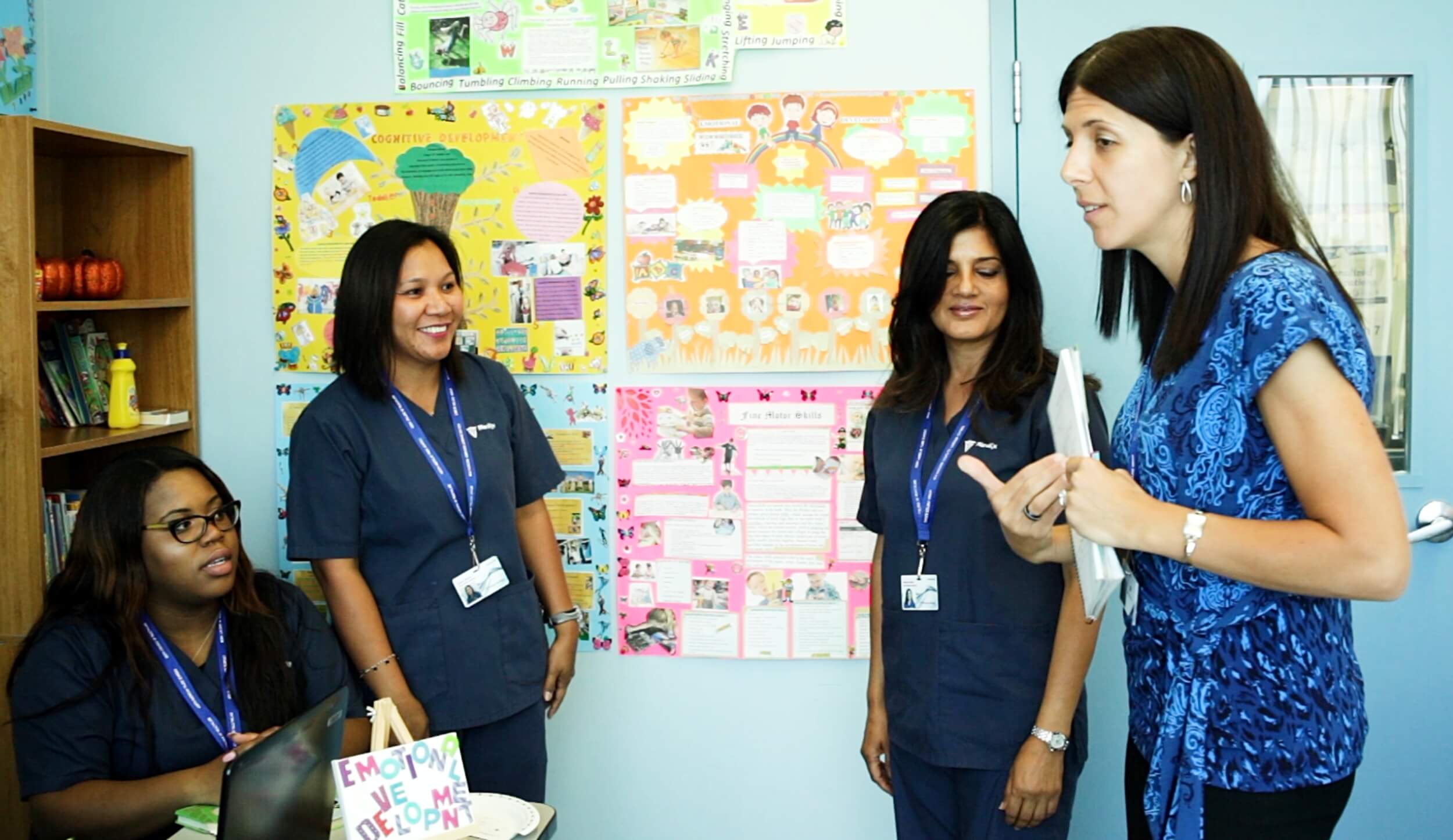 An instructor hosting an early childhood assistant class with students