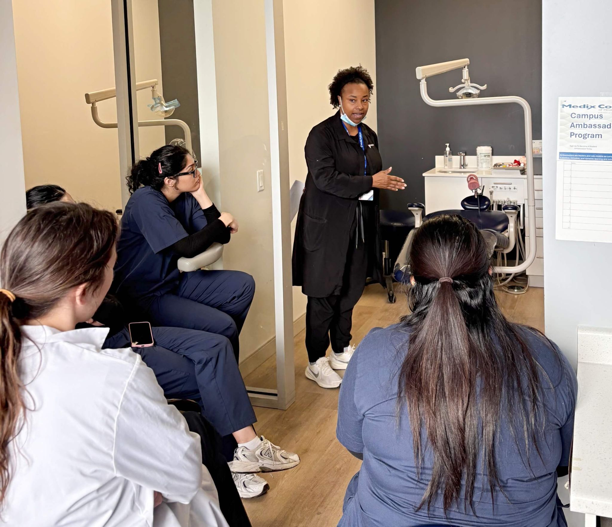 An Instructor giving a clinic-based demonstration to students in our dental assistant program in Toronto