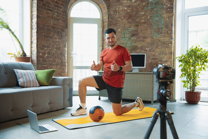 An online fitness coach leading a virtual workout session
