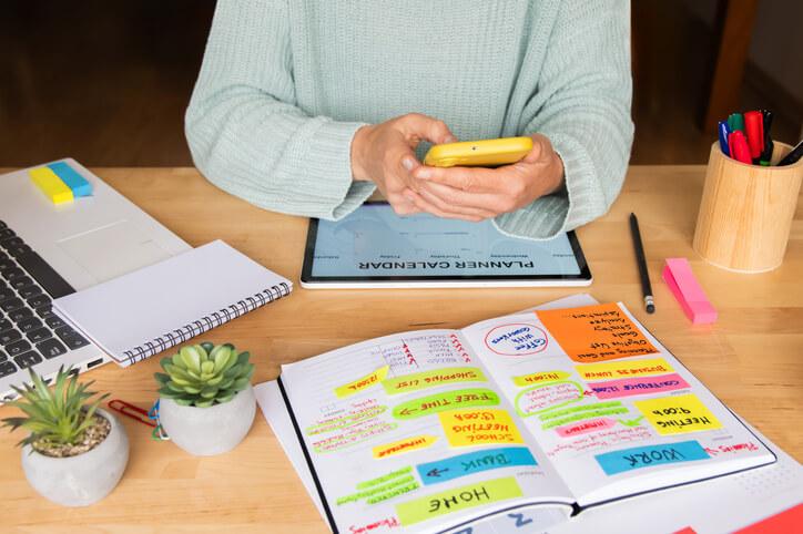 A student using a planner to avoid procrastination