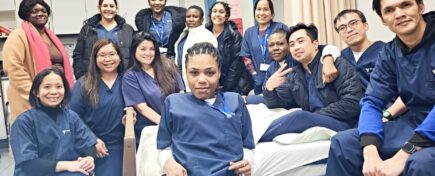 A group of career college students taking a group photograph
