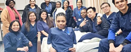 A group of career college students taking a group photograph