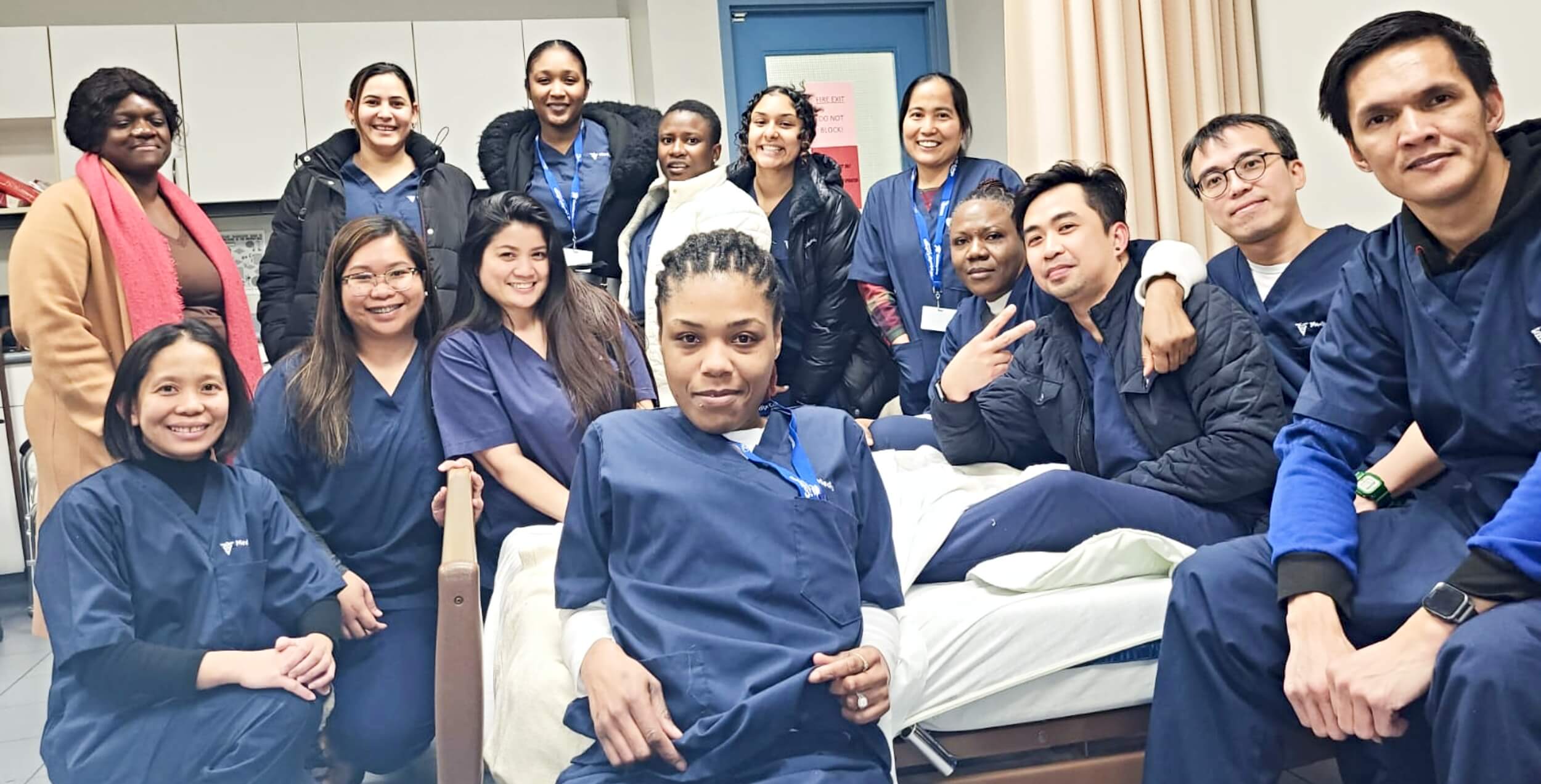 A group of career college students taking a group photograph