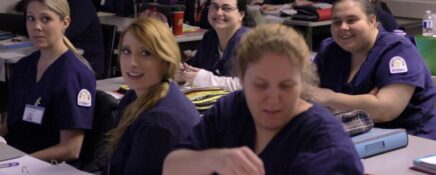 A group of PSW students learning about patient care at Medix College