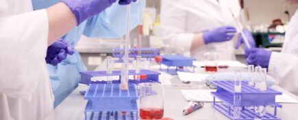 A medical lab assistant/technician program student preparing blood samples in a lab